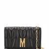 Moschino monogram-quilted clutch bag