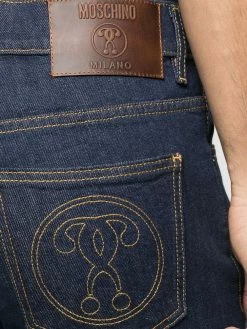 Moschino question mark embroidered jeans