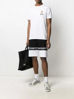 Moschino logo-print panelled swim trunks