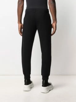 Moschino Symbols logo-embroidered fleece track pants