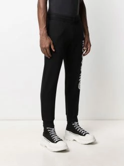 Moschino Symbols logo-embroidered fleece track pants