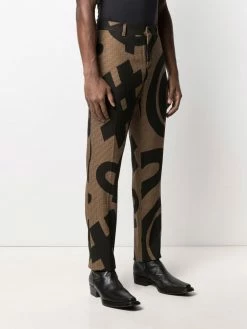 Promo โ๏ธ Moschino Graphic print pressed crease trousers ๐ 9 Moschino graphic-print pressed-crease trousers