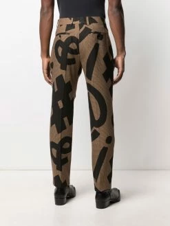 Promo โ๏ธ Moschino Graphic print pressed crease trousers ๐ 10 Moschino graphic-print pressed-crease trousers