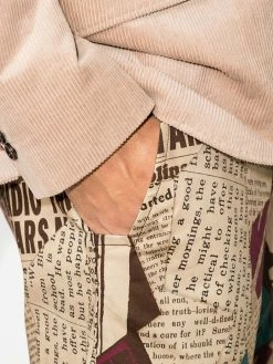 Moschino newspaper print Bermuda shorts