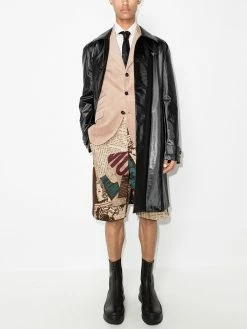 Moschino newspaper print Bermuda shorts