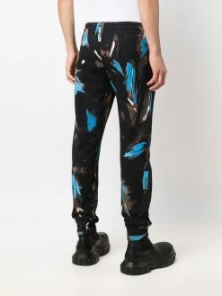 Moschino painted logo trousers