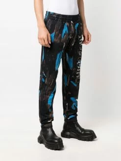 Moschino painted logo trousers