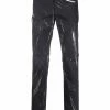 Moschino faded logo-print trousers