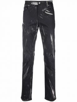 Moschino faded logo-print trousers