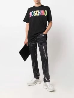 Moschino faded logo-print trousers