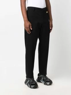 Moschino logo embellished tailored trousers