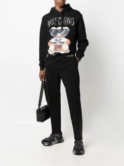 Moschino logo embellished tailored trousers