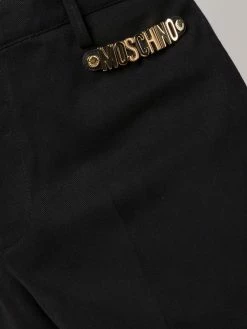 Moschino logo embellished tailored trousers