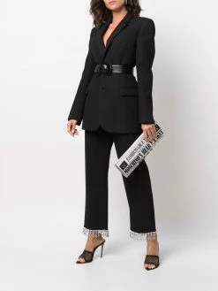 Moschino logo newspaper-print clutch bag