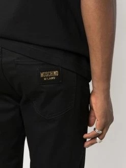 Moschino logo-plaque straight-leg trousers