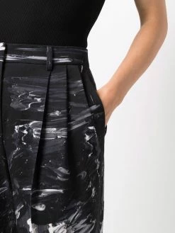 Moschino slim-fit paint-print trousers