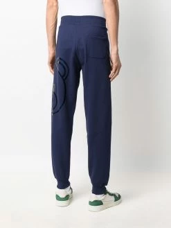 Moschino metallic Teddy print track pants